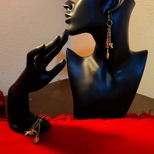 Brass dangling earrings with coyote horse and road runner